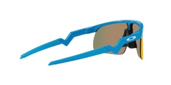 Juniorské OAKLEY RESISTOR SKY BLUE / PRIZM RUBY