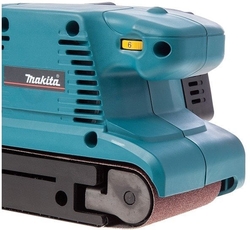 Makita 9911 Pásová bruska s regulací 650W, 457x76mm